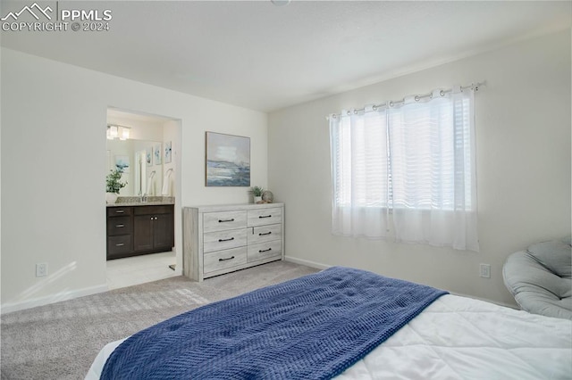 carpeted bedroom featuring connected bathroom