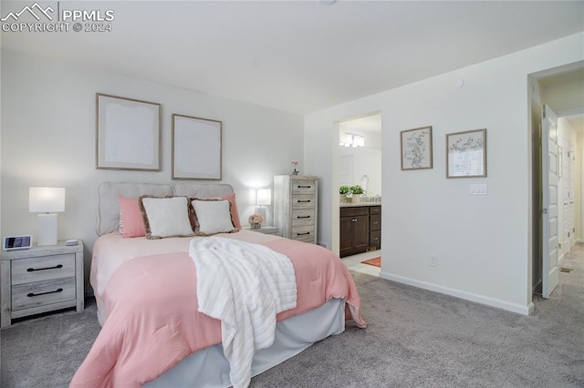 carpeted bedroom with connected bathroom