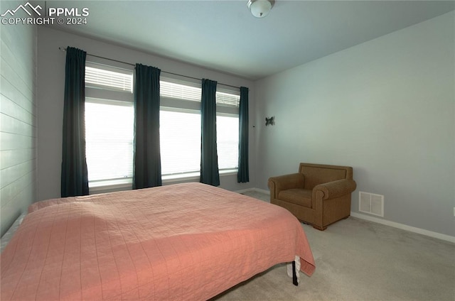 bedroom with light colored carpet