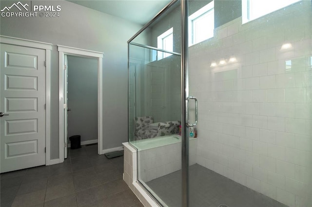 bathroom featuring tile patterned flooring and an enclosed shower