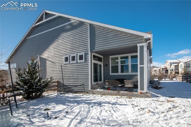 view of snow covered house