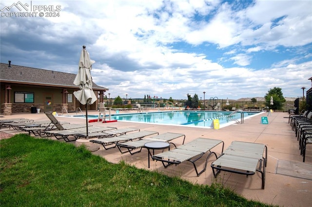 view of pool featuring a patio area