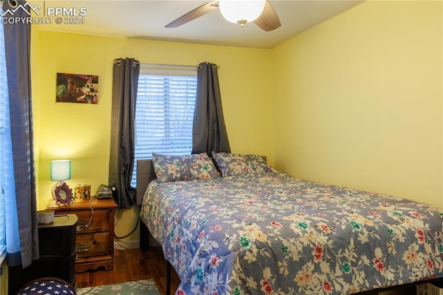 bedroom featuring ceiling fan and dark hardwood / wood-style floors