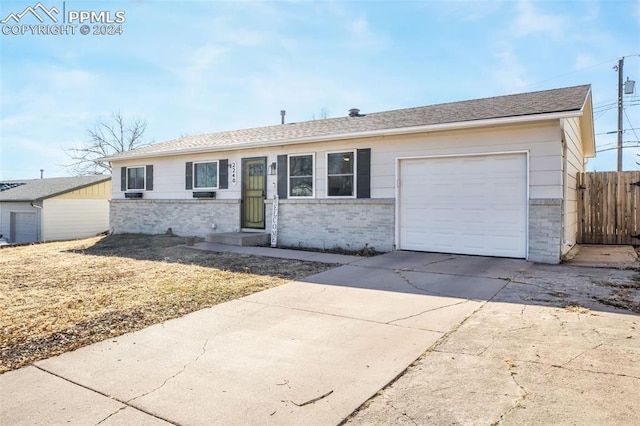 ranch-style house featuring a garage