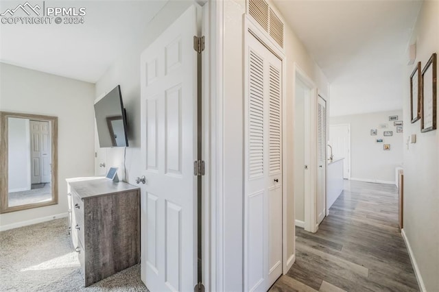 corridor with wood-type flooring