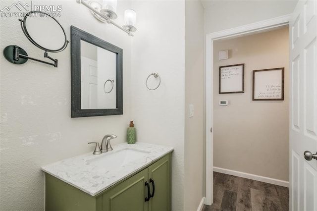 bathroom featuring hardwood / wood-style floors and vanity