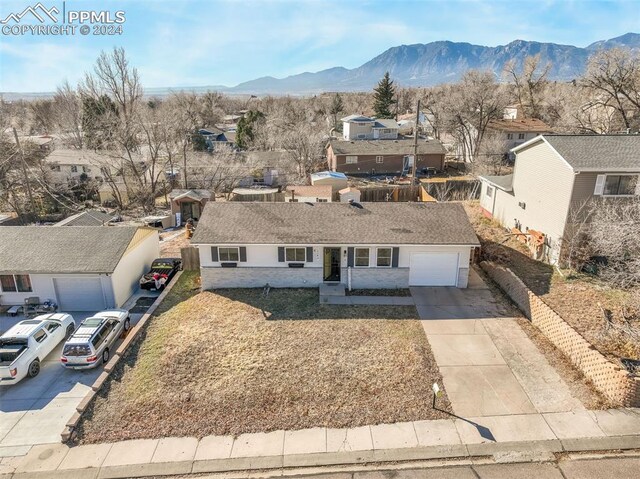 view of front of home with a mountain view