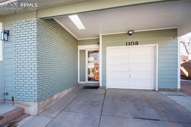 property entrance with a garage