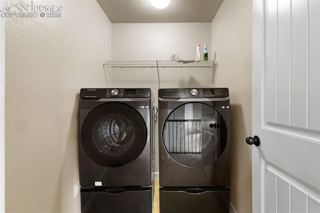 laundry area with laundry area and separate washer and dryer