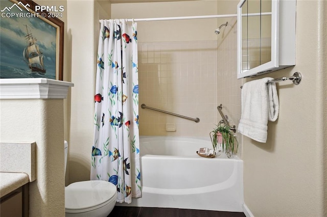 full bathroom with shower / tub combo, vanity, and toilet