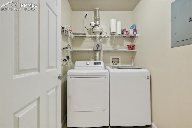 washroom with washer and dryer and electric panel