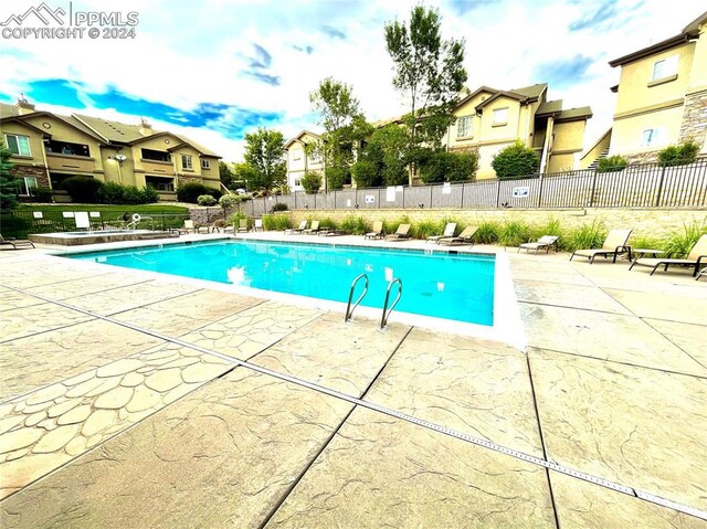 view of swimming pool with a patio