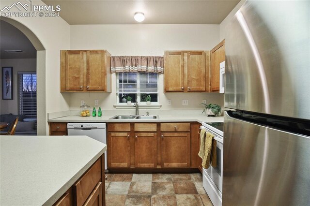 kitchen with white appliances and sink