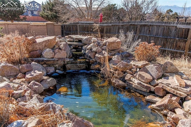 exterior space with a small pond