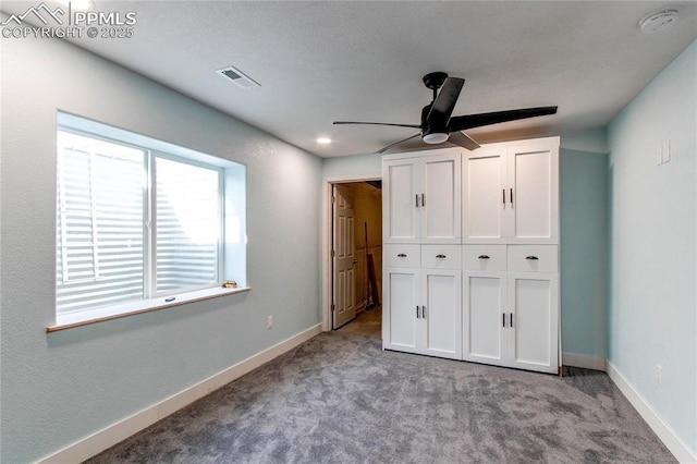 unfurnished bedroom with ceiling fan, a closet, and light colored carpet