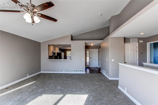 unfurnished living room featuring dark colored carpet, ceiling fan, and lofted ceiling