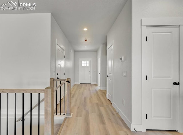 hall with light hardwood / wood-style flooring