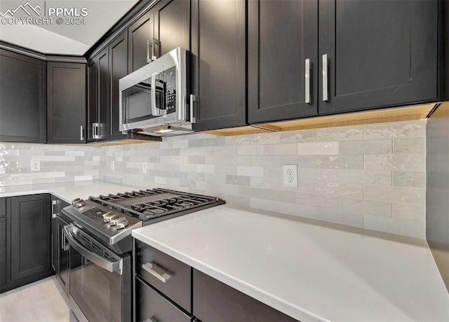 kitchen featuring decorative backsplash and stainless steel appliances