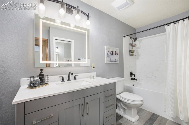 full bathroom featuring toilet, vanity, shower / bath combination with curtain, and hardwood / wood-style flooring