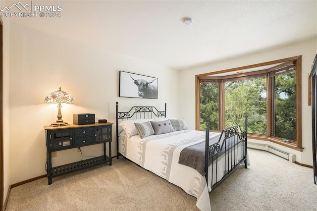 carpeted bedroom with baseboard heating