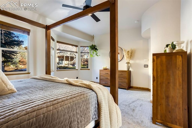 carpeted bedroom with multiple windows and ceiling fan