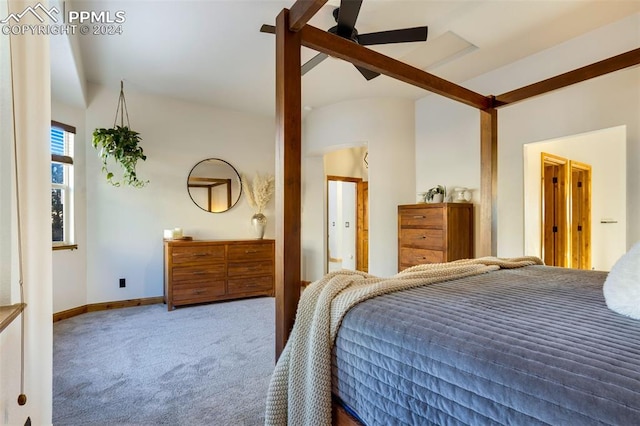 carpeted bedroom with ceiling fan and vaulted ceiling