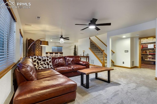 living room with ceiling fan and light colored carpet