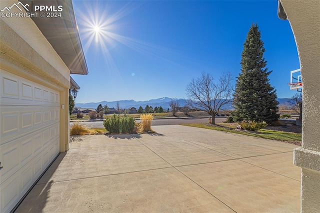 view of patio / terrace with a mountain view