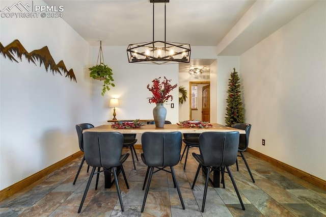 dining room with a notable chandelier