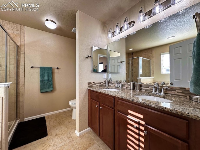 bathroom with tile patterned flooring, an enclosed shower, a textured ceiling, and toilet