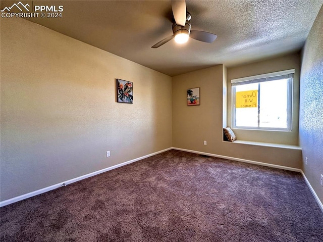 empty room featuring a textured ceiling, carpet floors, and ceiling fan