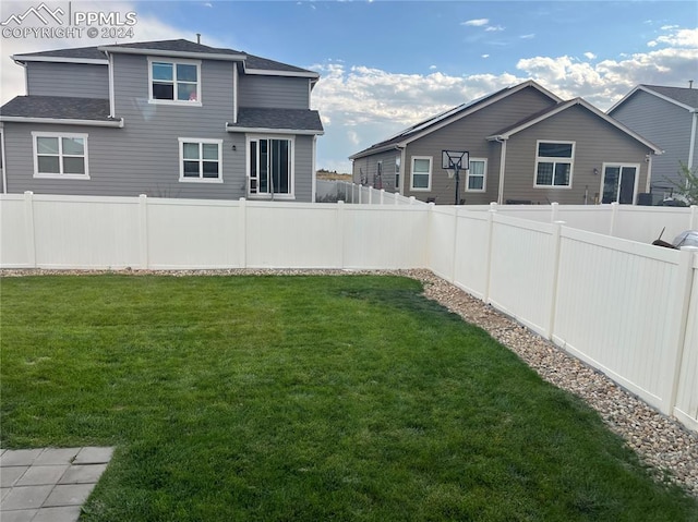 view of yard with a fenced backyard