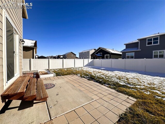 view of patio / terrace featuring a residential view and a fenced backyard