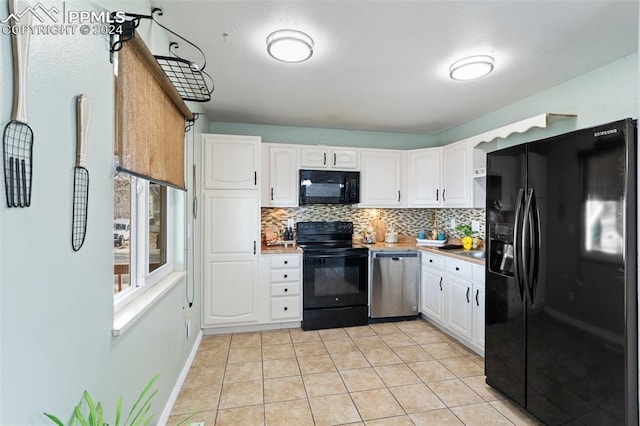 kitchen with decorative backsplash, light tile patterned flooring, white cabinetry, and black appliances