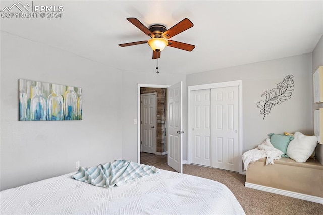 carpeted bedroom with ceiling fan and a closet