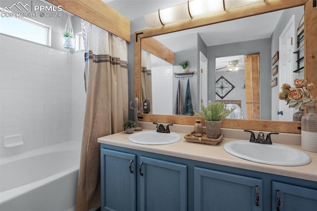 bathroom featuring vanity, ceiling fan, and shower / bath combo with shower curtain