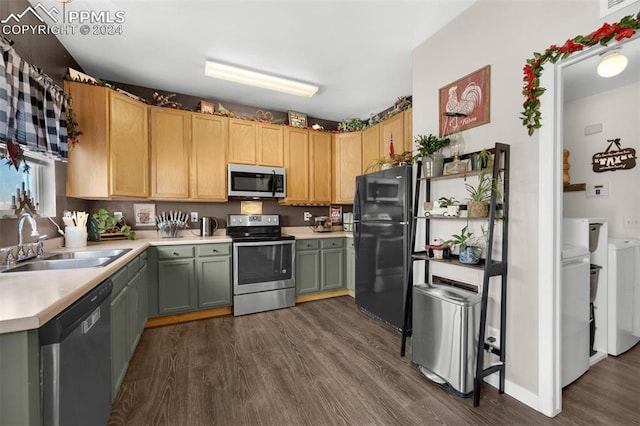 kitchen with washing machine and clothes dryer, sink, light brown cabinets, dark wood-type flooring, and stainless steel appliances