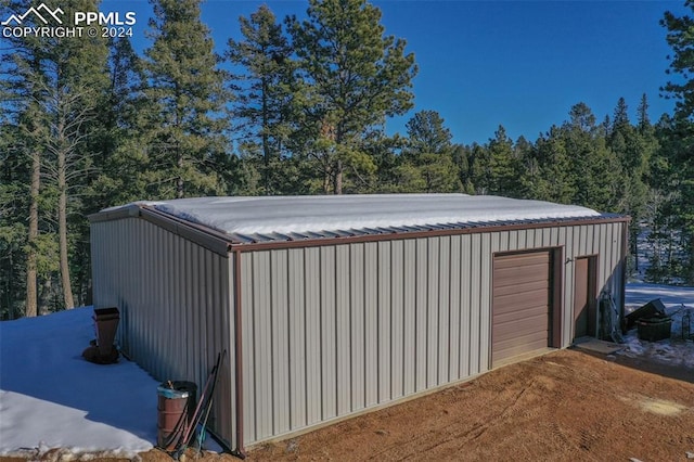 view of outbuilding with a garage