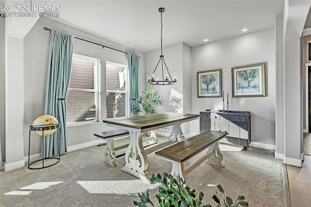 dining area featuring a chandelier