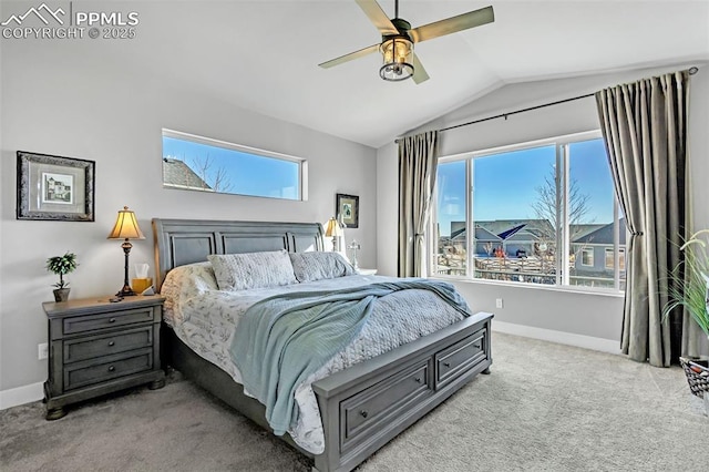 bedroom with ceiling fan, light colored carpet, lofted ceiling, and multiple windows