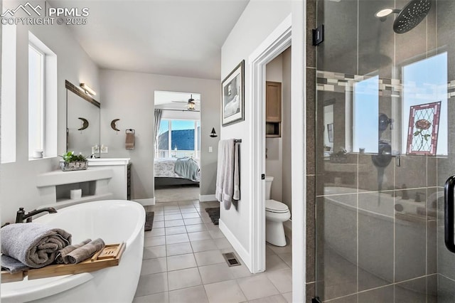 full bathroom with plus walk in shower, toilet, ceiling fan, and tile patterned flooring