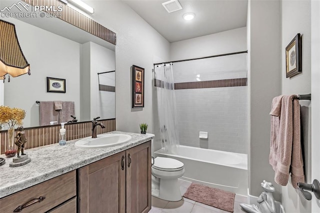 full bathroom with vanity, toilet, tile patterned floors, and shower / tub combo