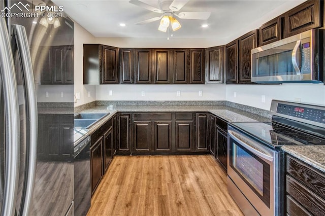 kitchen featuring sink, light hardwood / wood-style flooring, ceiling fan, appliances with stainless steel finishes, and dark brown cabinetry