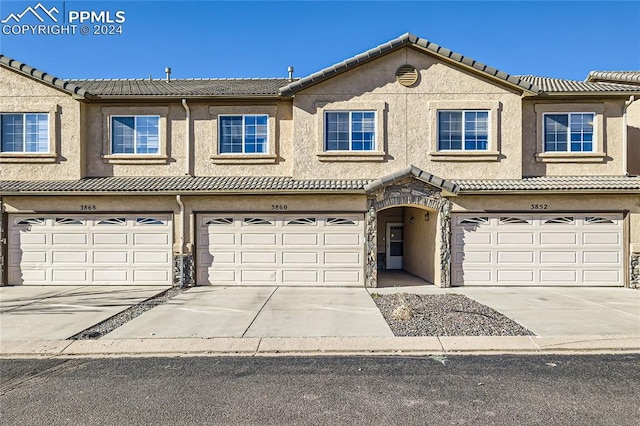 view of front of property with a garage