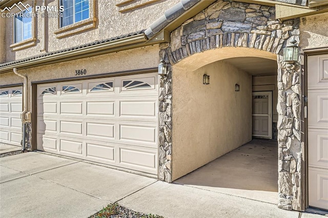 doorway to property featuring a garage