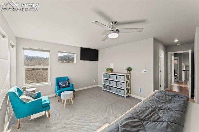 bedroom featuring ceiling fan and carpet