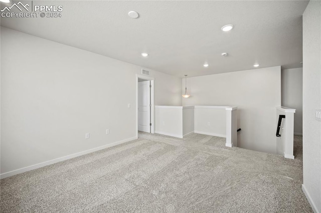 spare room with light colored carpet