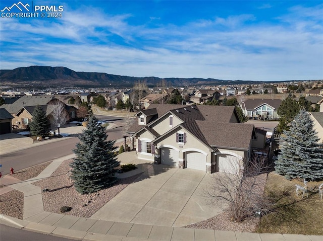 birds eye view of property featuring a mountain view