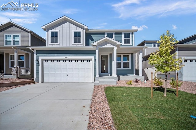 view of front of house with a garage and a front lawn