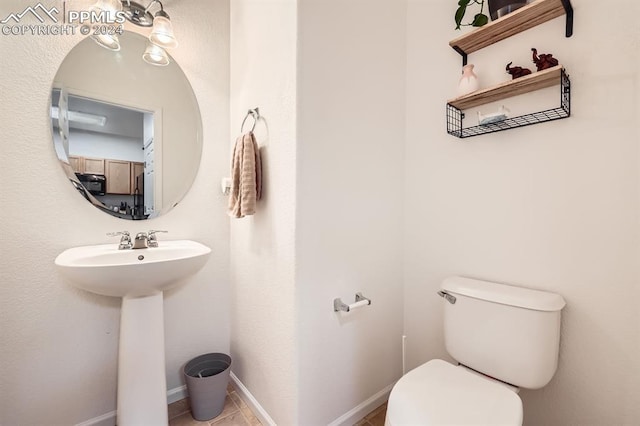 bathroom with toilet and sink